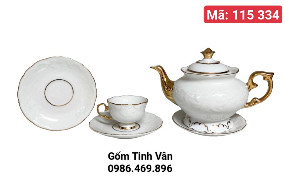 Bộ bình trà men trắng viền vàng 24k cao cấp, mã 115334 dáng bình đèn thần quý tộc,hoạ tiết hoa sen đắp nổi 2D trọn bộ gồm 1ấm,6 ly, 7 đĩa,gốm sứ Bát Tràng Tinh Vân