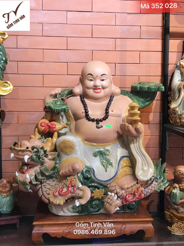 Tượng phật di lặc, mã 352028, cưỡi cá chép hoá rồng, nâng vàng , cầm gậy như ý, cao 55 cm, ngang 50 cm, men rạn cổ đắp nổi, gốm sứ bát tràng, tinh vân