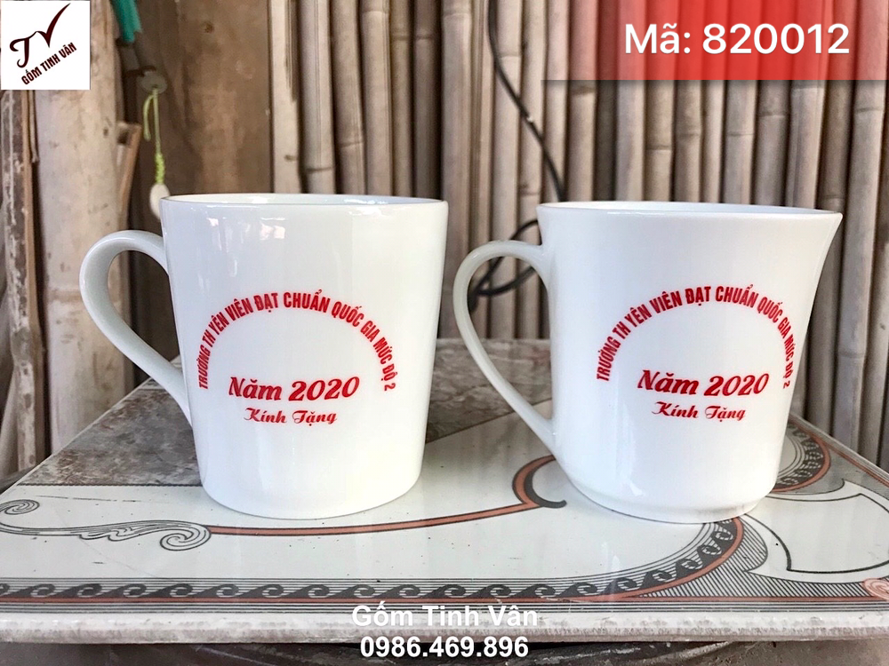 Ly sứ trắng dáng loe, mã 820012, dung tích 280ml, cao 10 đk 8 cm, in logo trường Yên Viên đạt chuẩn quốc gia, giá báo trên 100 chiếc, gốm bát tràng tinh vân