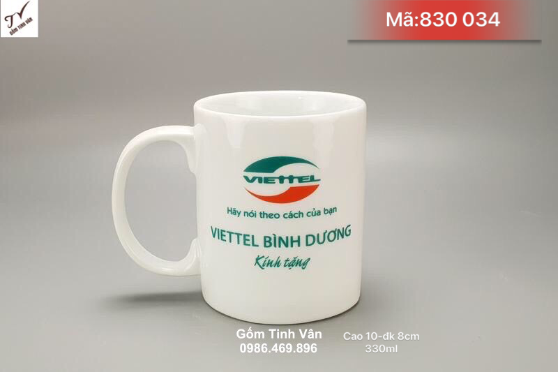 Ly sứ men trắng quai C in logo viettel bình dương, mã 830034, in thương hiệu công ty, quà tặng khách hàng, cao 10 đường kính 8 cm, dung tích 330 ml, giá báo trên 100 chiếc, cốc sứ quà tặng gốm sứ bát tràng